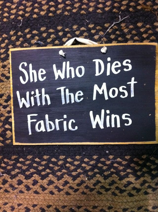 She who dies with the most fabric wins sign