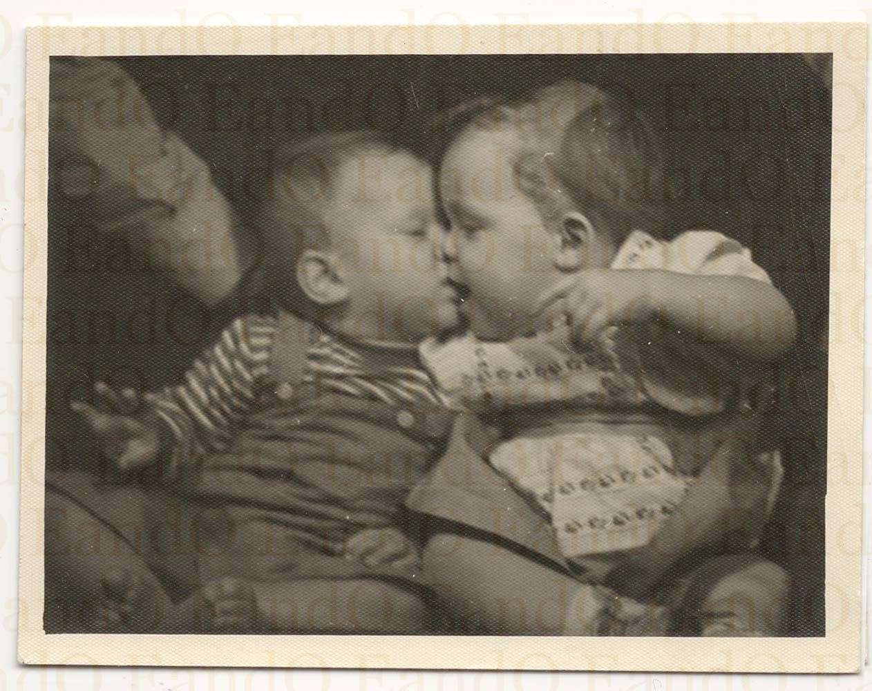 two baby kissing