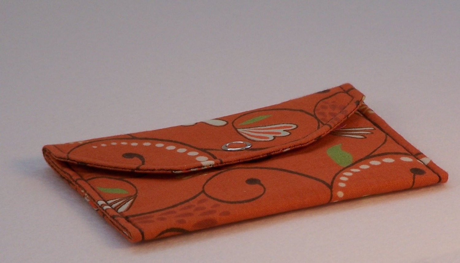 Card Pocket with an Orange and Brown Scroll