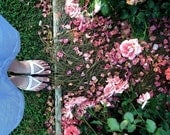Her Garden: fine art self-portrait photograph print with pink roses and scattered petals, green grass, blue skirt, and feet