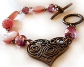 Love Bracelet with mother of pearl and glass beads in pink and lilac