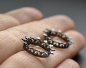 Black sun post silver earrings,