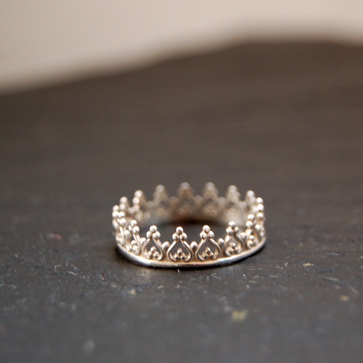 There is no queen without a crown ring, silver band,