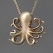Long Baby Octopus Necklace in Brass with Rubies