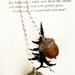 3 sets of golden acorns . ornaments