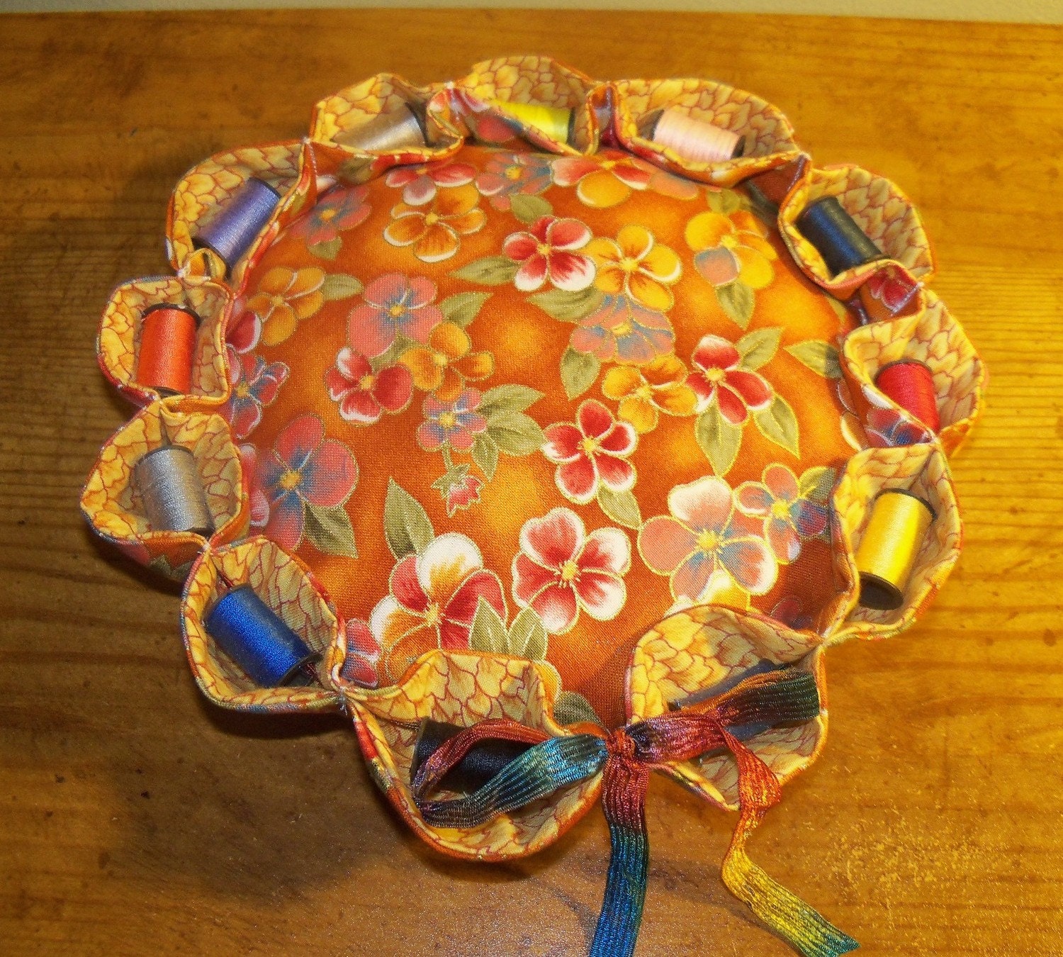 large 8"pincushion with 12 spools of thread