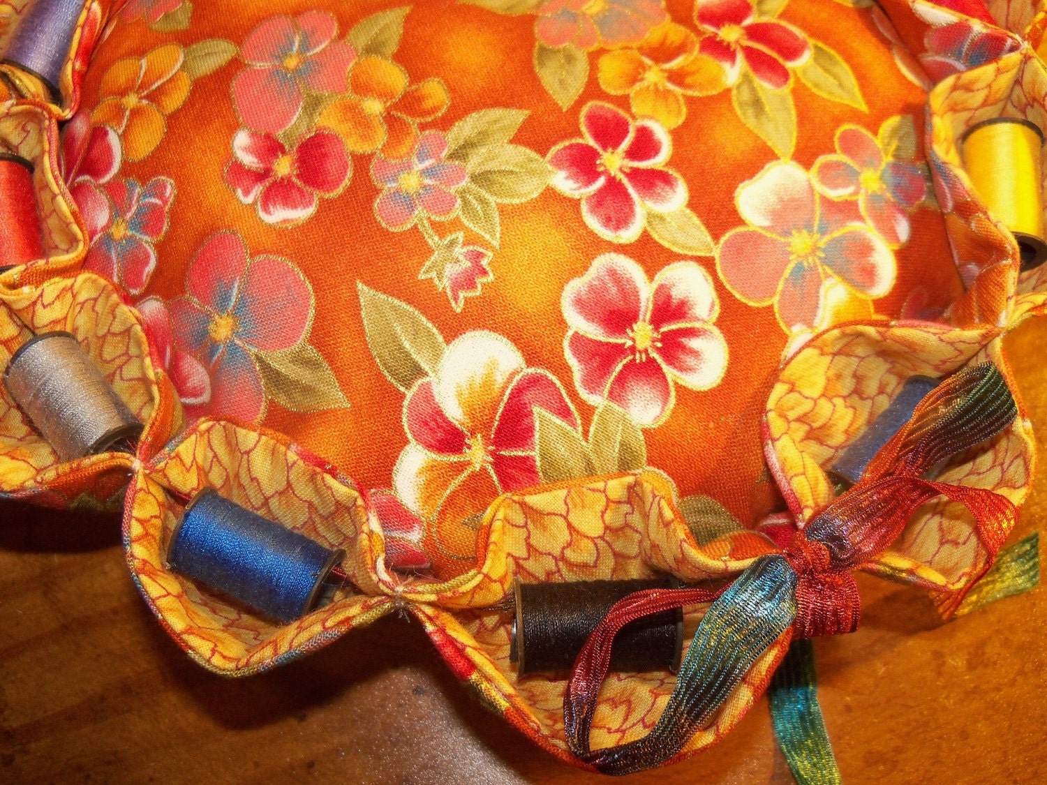 large 8"pincushion with 12 spools of thread