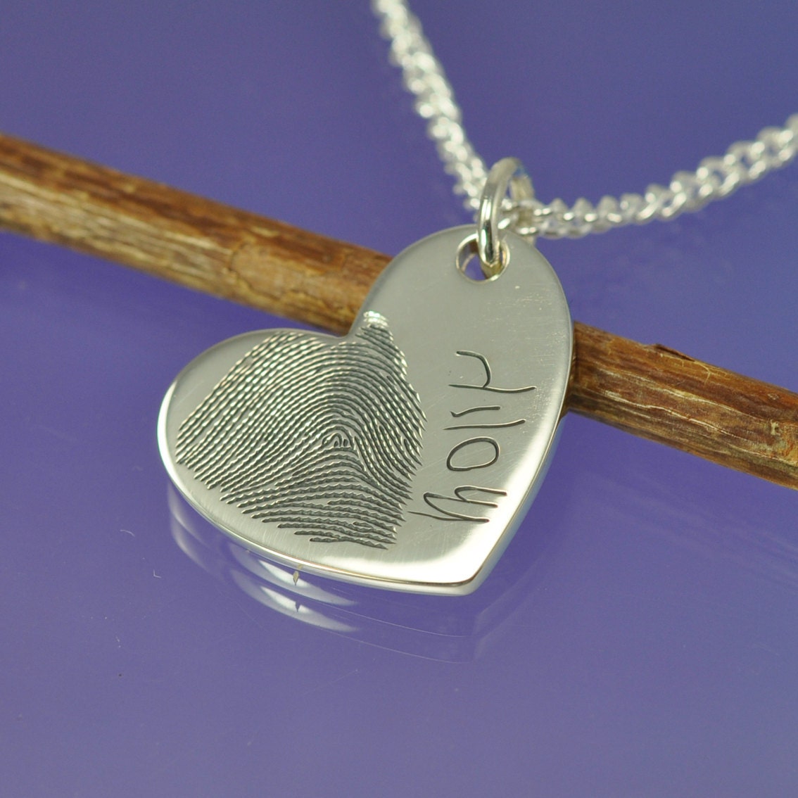 Fingerprint heart pendant. Your finger print hand engraved onto a sterling silver pendant.