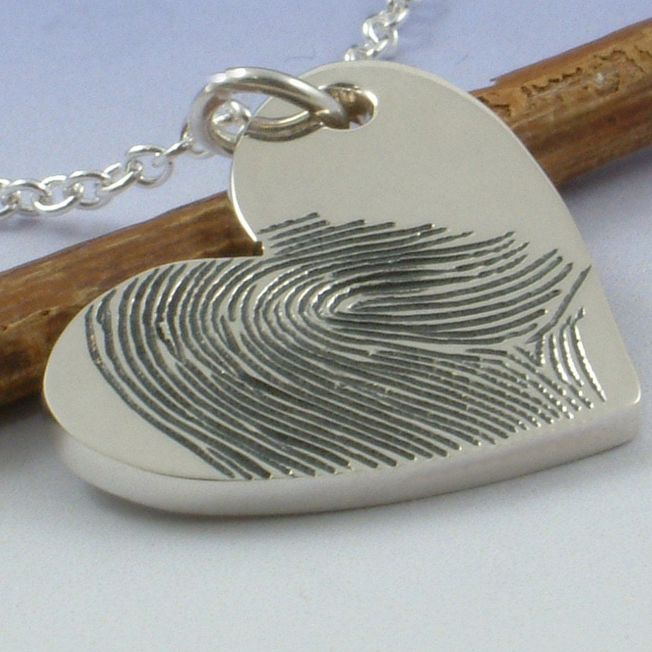 Fingerprint pendant. Your finger print hand engraved onto a sterling silver heart shaped pendant.