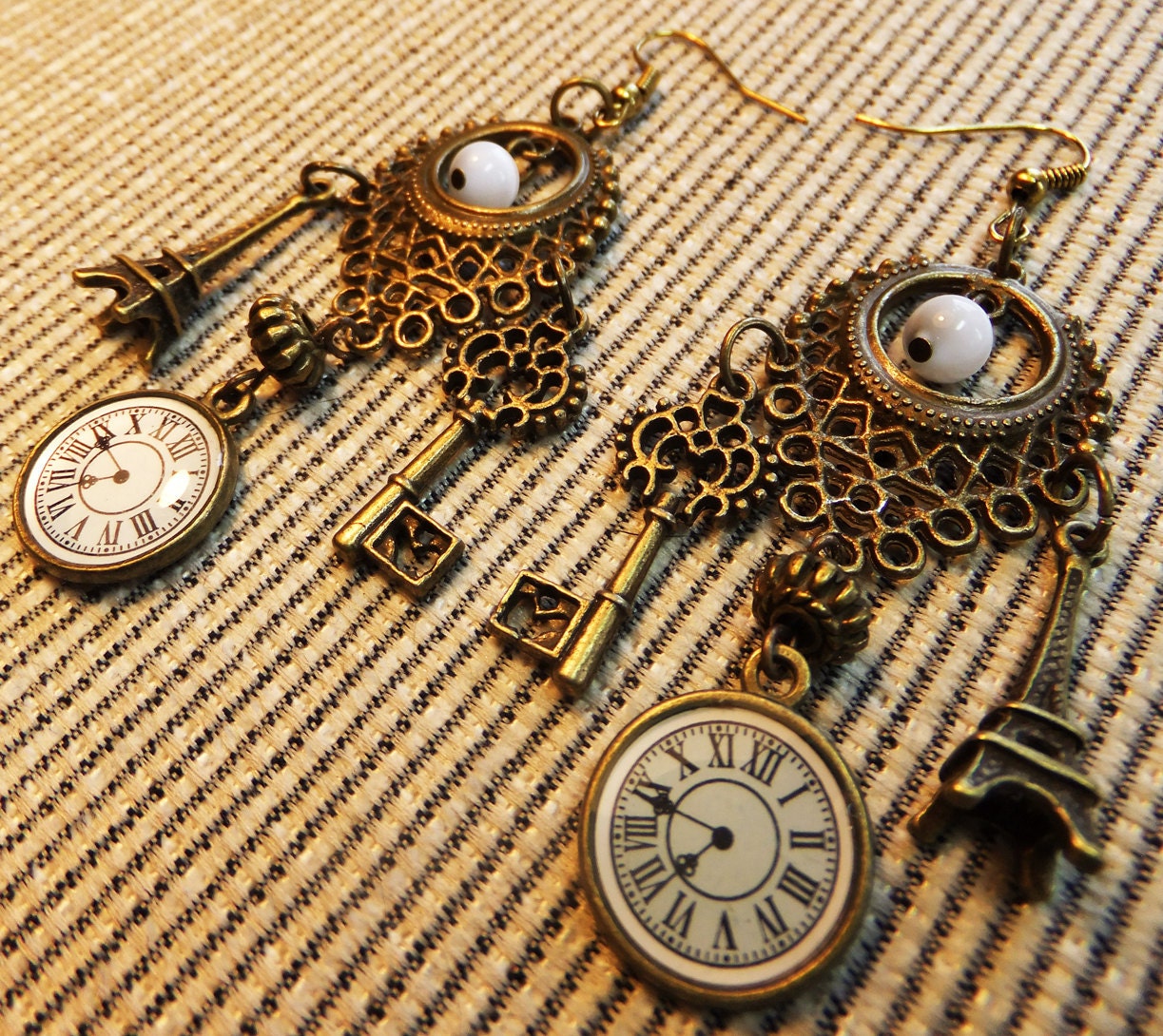 Steampunk Brass Clockfaces, Victorian Key, and Eiffel Tower Charms, Filigree with Cats Eye Beads Dangle Earrings Perfect for a Hugo Fan
