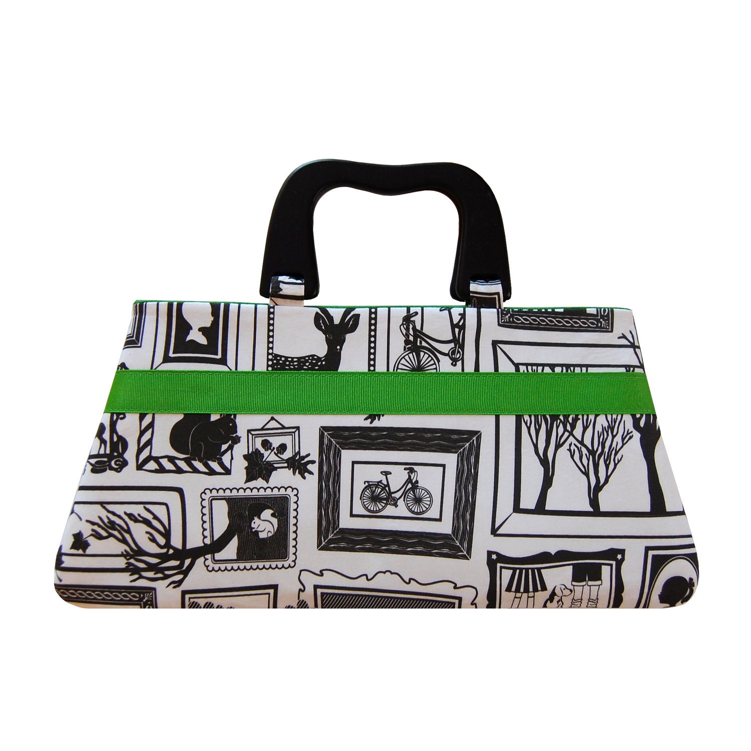 Handbag in black and white gallery with green ribbon accent
