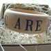 wooden bangle bracelet- YOU ARE LOVED -words on your wrist- with stamped text by Paloma's Nest
