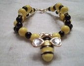 Xicohtencatl Collection Bracelet Black Yellow Beads Red Ribbon Winner