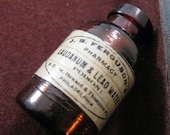 Reproduction vintage laudanum and lead water miniature glass poison bottle charm
