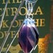 Plum twist glass and crystal earrings