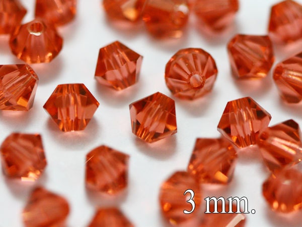 50 pcs. Swarovski Crystal Bicone Padparadscha 3 mm.