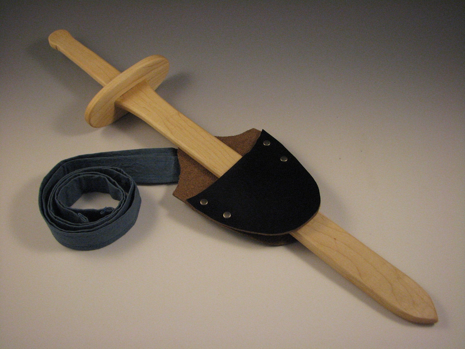 Wooden sword and leather sheath with strap