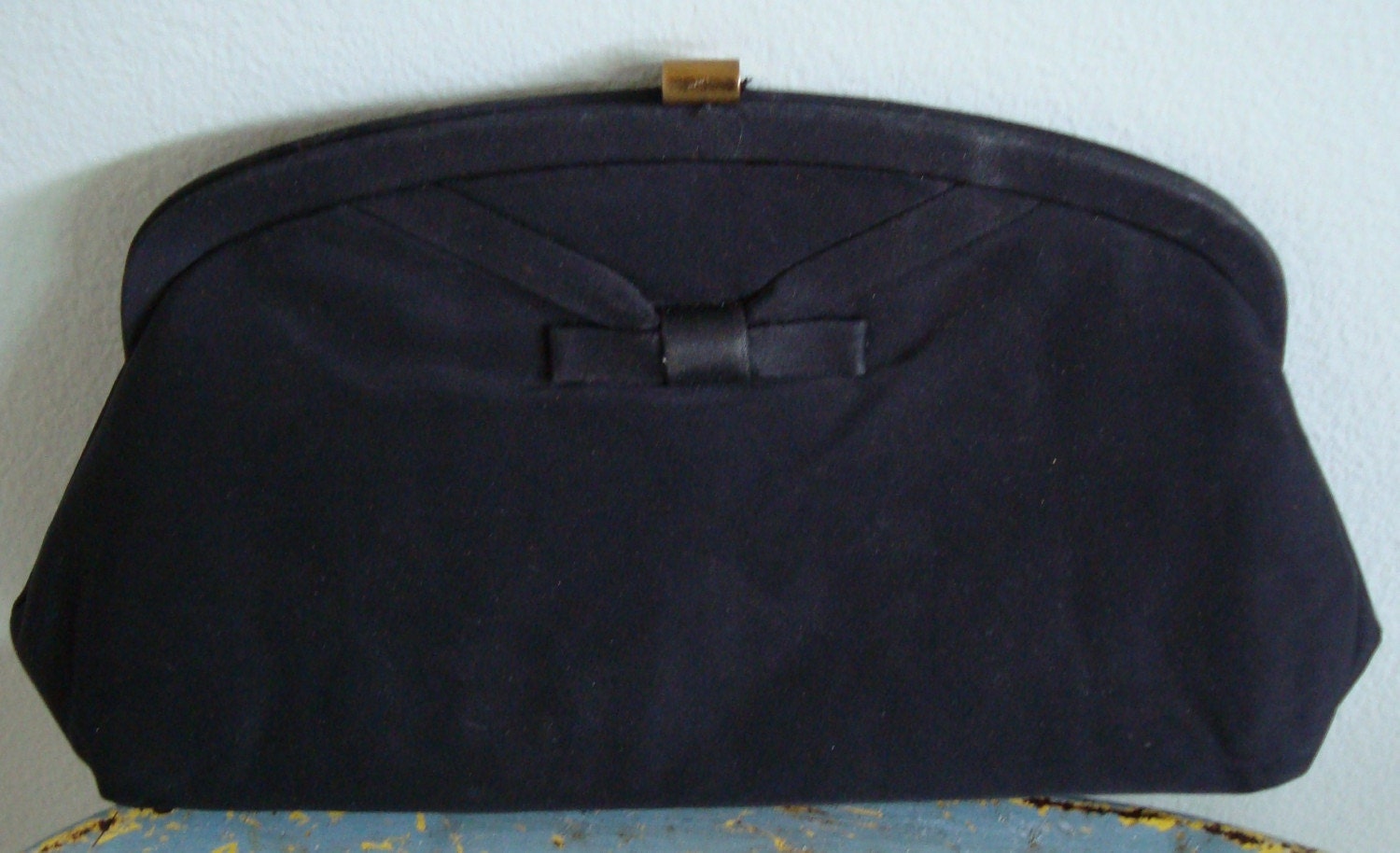 Vintage black clutch with bow and gold chain handle