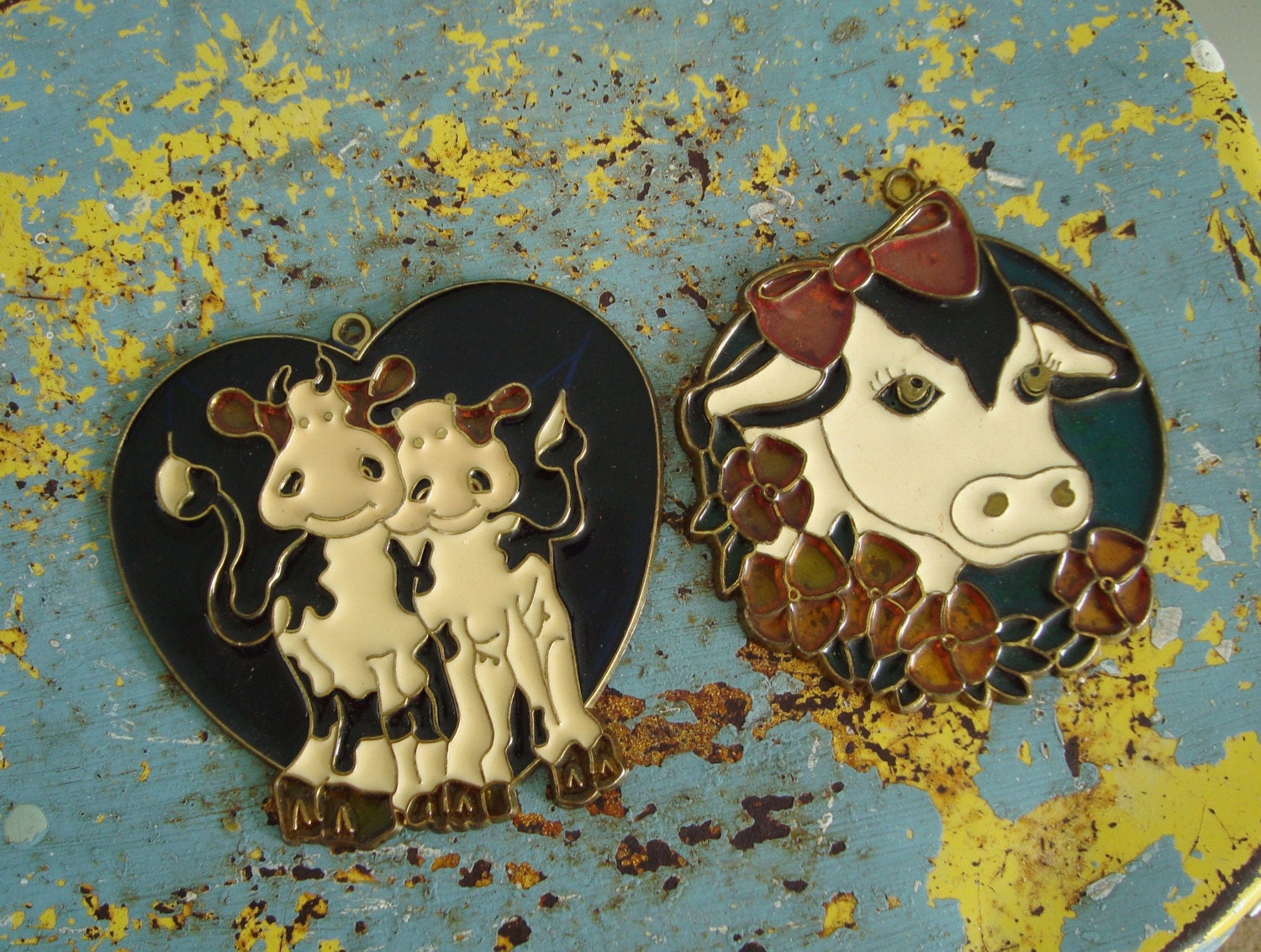 2 vintage cow suncatchers