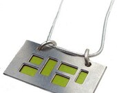 silver pendant with Lime and Black cutouts