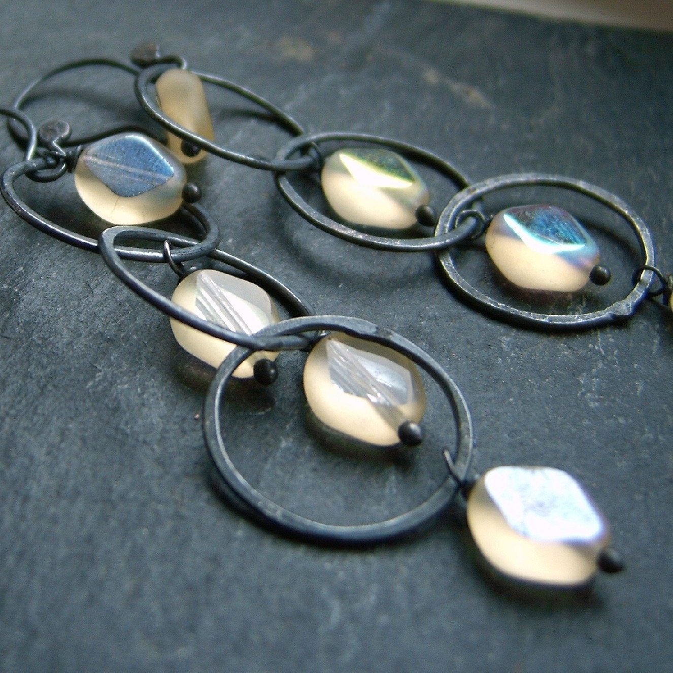 Vintage glass long silversmithed chain circle link earrings. Pale pastel jonquil lemonade sparkle, black silver. Modern jewellery