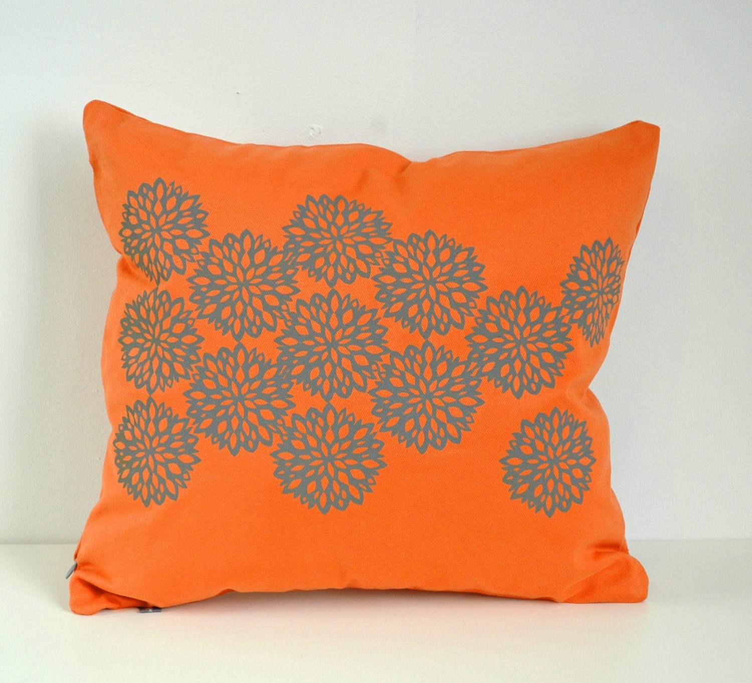 Orange Pillow with Astera Print