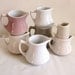 Set of 7 vintage pastel creamers