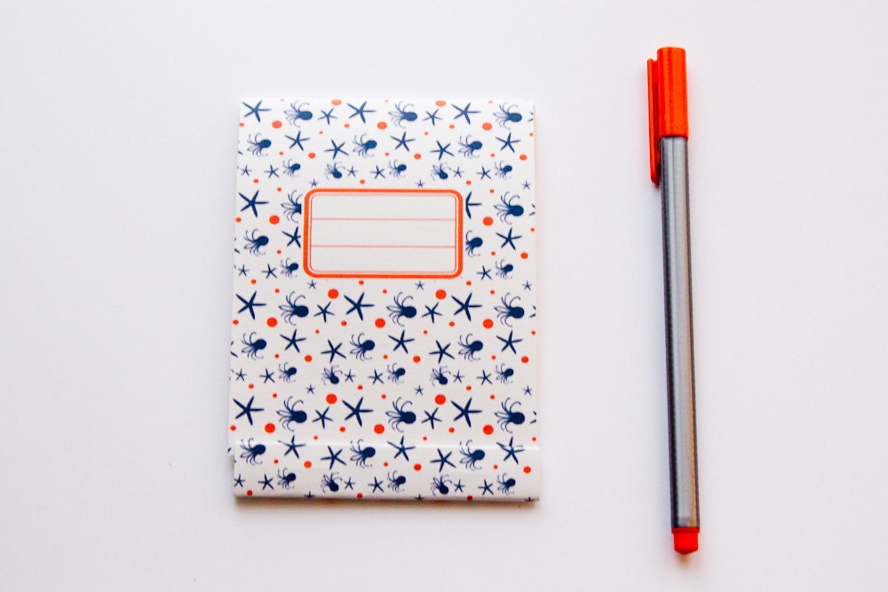 Notepad, orange and navy blue pattern with octopus and sea stars