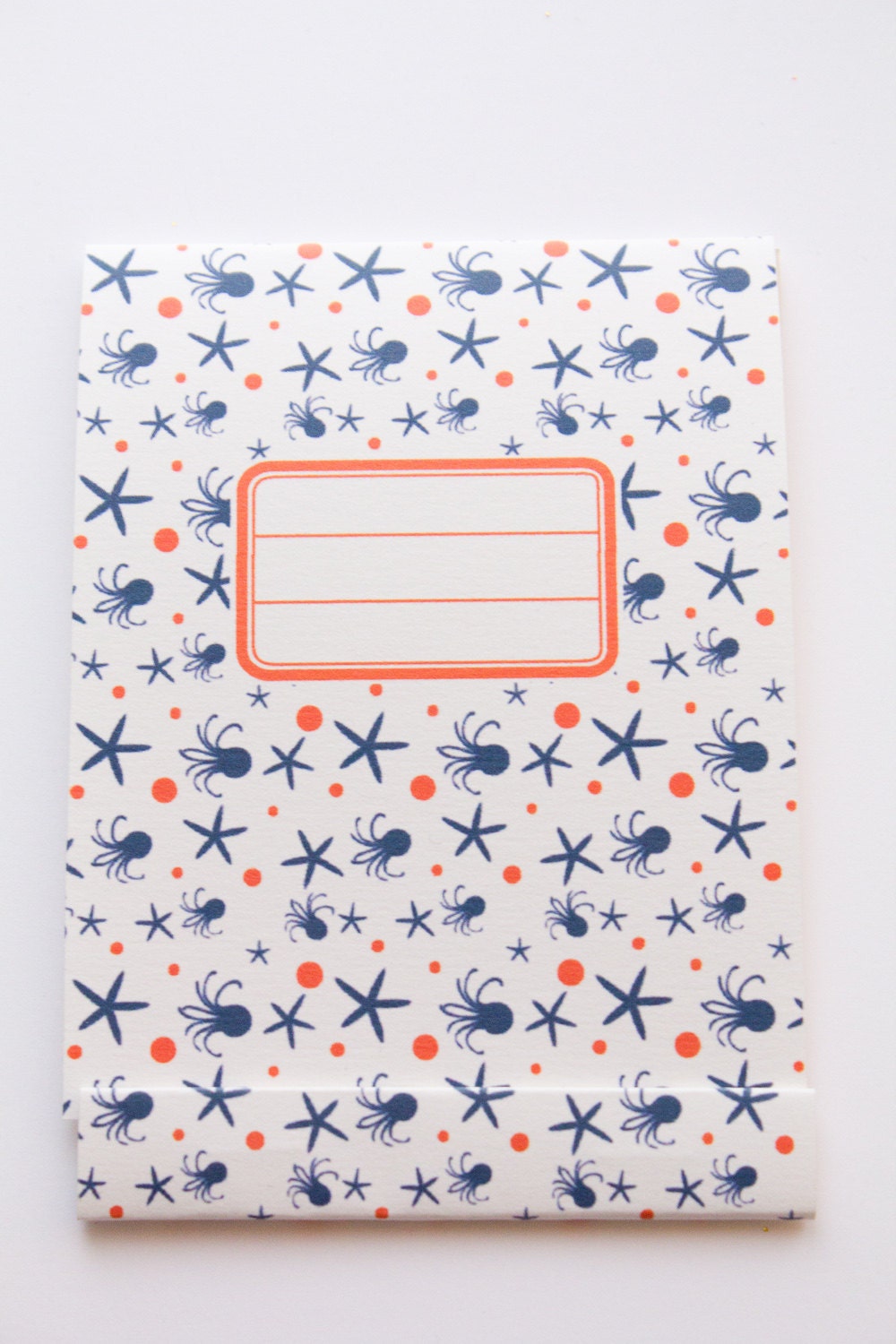 Notepad, orange and navy blue pattern with octopus and sea stars