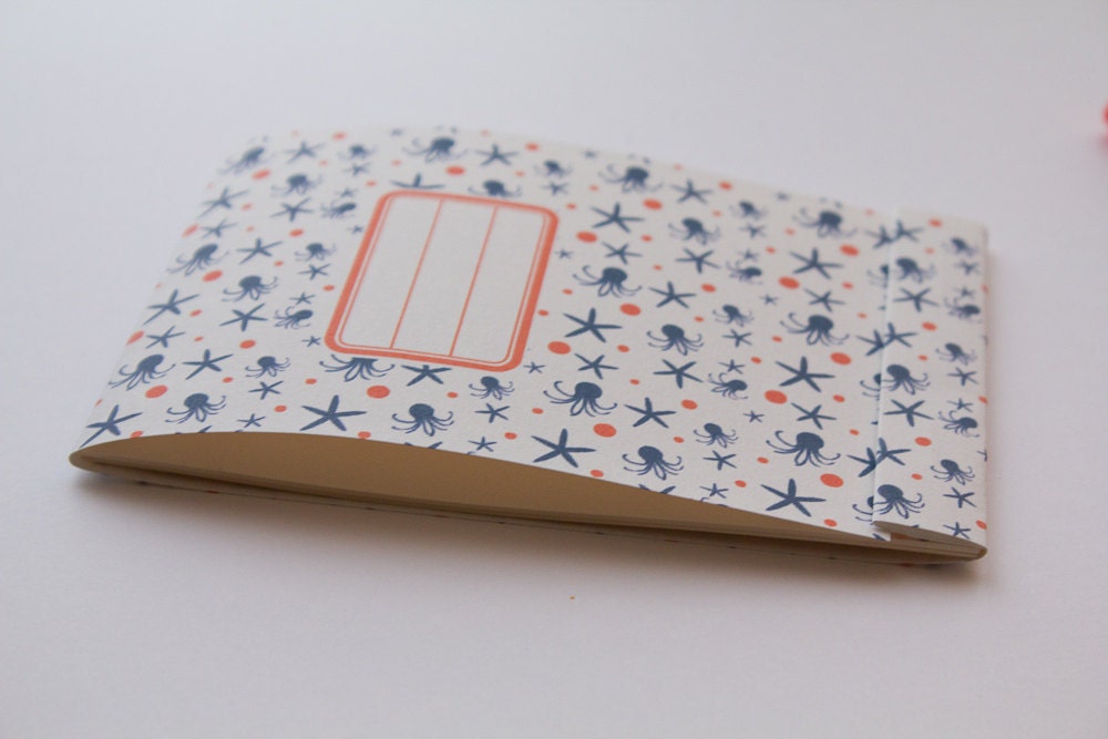 Notepad, orange and navy blue pattern with octopus and sea stars