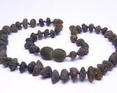 Grey rounded beads Baltic sea amber teething necklace for your baby.