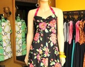 Halter summer dress with a beautiful floral print in rose pink yellow and black