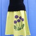 Purple Flowers on a Lime Green Skirt