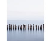 Minimalist Seascape Landscape Photography - Haunting row of eerie old wood posts with holes in calm blue ocean water - Lake Erie 4 8x10