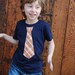 2T........NAVY fine Jersey T-shirt with an ORANGE PLAID neck tie applique ........... COMFORTABLE AND TRENDY