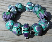 Handmade lampwork beads, purple and teal, raked designs, "Matchmaker"