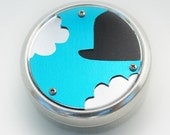 Metal Pillbox / Tin / Container with Anodized Aluminum Design - Magritte's Hat in the Clouds