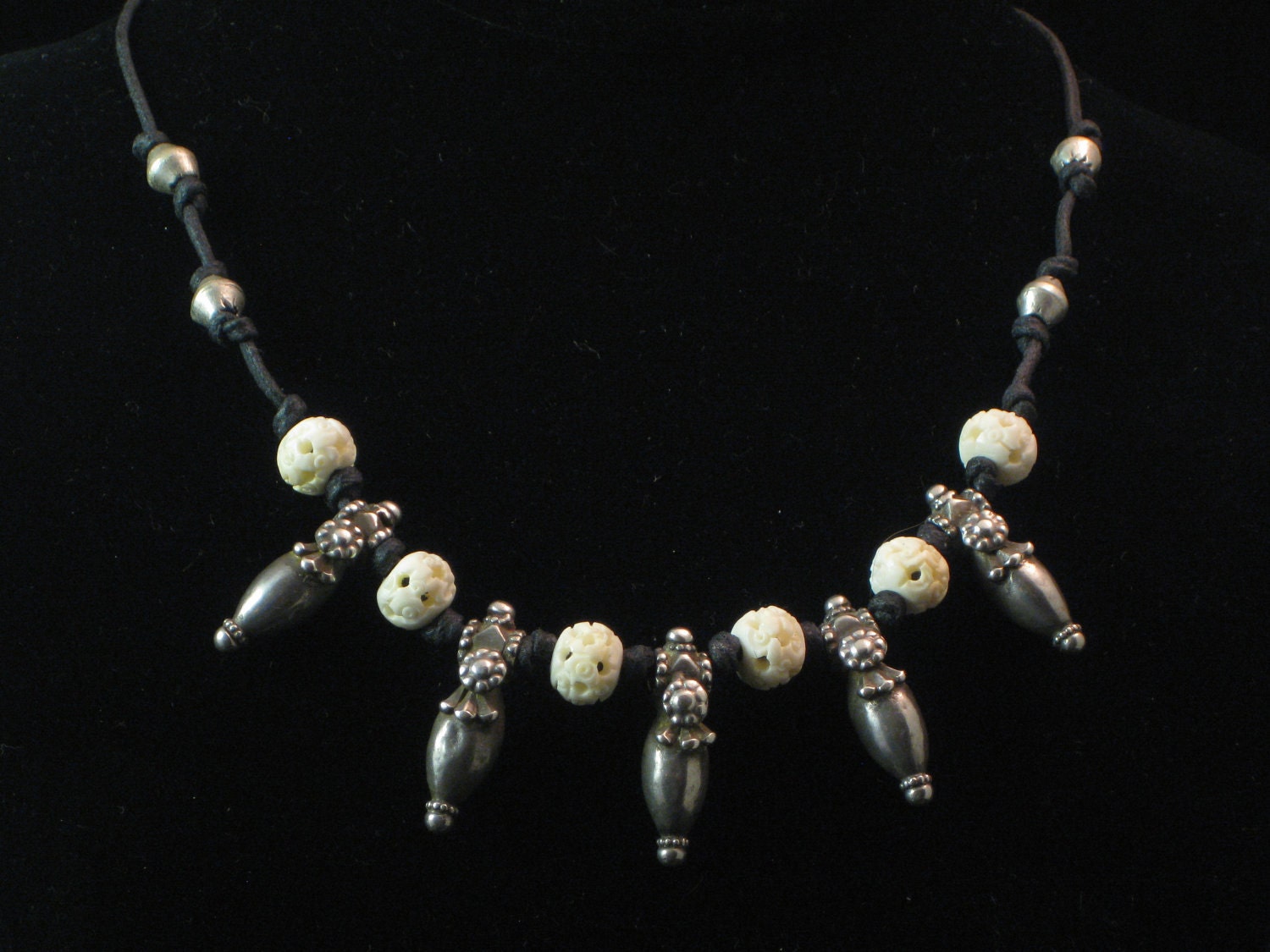 Necklace: rare, old Afghani amulets with carved bone beads