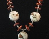 Necklace: Tibetan conch shell and coral beads, with jasper and Ethiopian bicone and ring beads