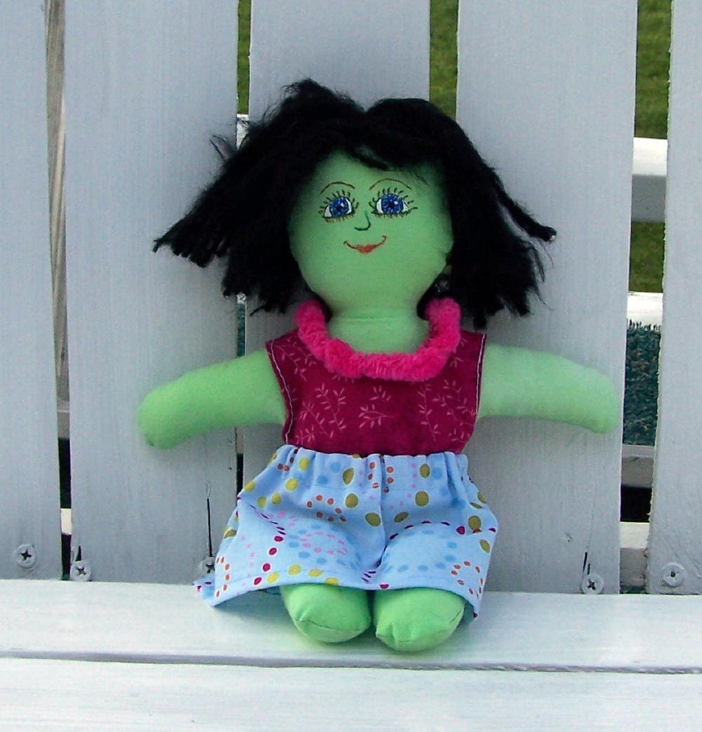 Green rag doll with blue eyes and black hair