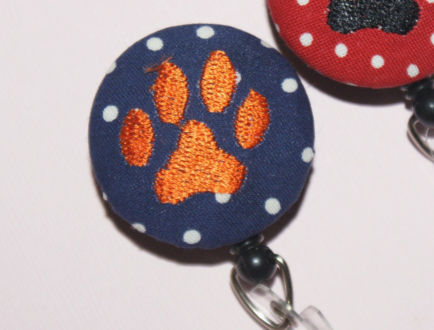 ONE  Initial id reel, retractable cord,  You pick fabric with PAW PRINT embroidery