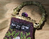 brass and plum purple hand beaded bag