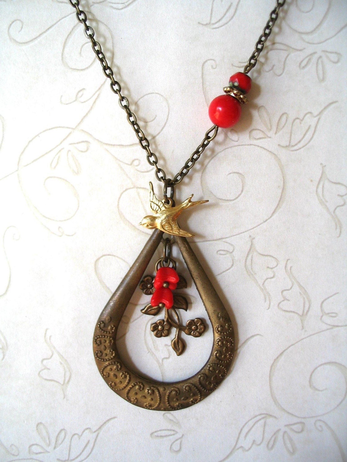 Vintage brass teardrop necklace - large pendant with brass bird charm and red flower beads