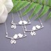 Love birds on a branch with personalized hand stamped initial leaf necklace