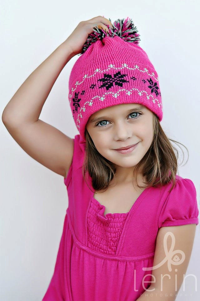 Pink Knit Hat with Black Snowflakes and Green Nordic Trim Big Pom Pom