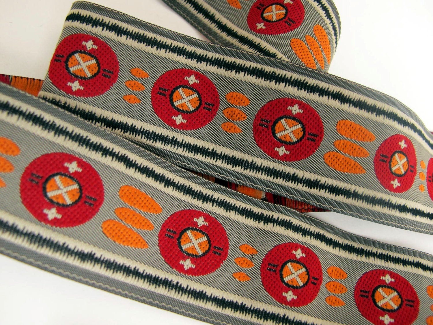3 yards RISING SUN Jacquard trim in red, orange, black, ivory on grey. 1 1/4 inch wide. 413-B