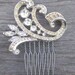 Scrolling rhinestone comb