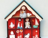 A doll house with dolls and toys ooak