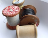 Four pretty vintage cotton reels