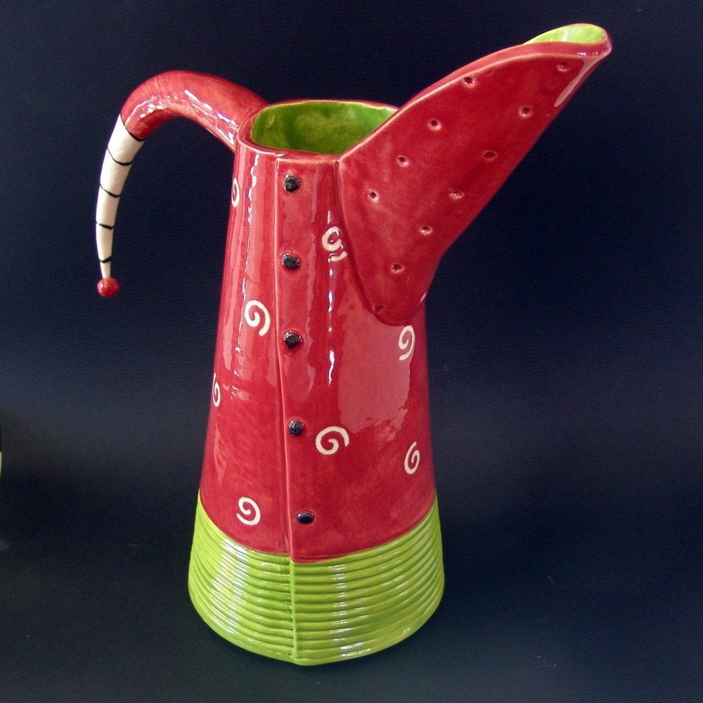 red & lime pitcher w/ black and white stripe handle